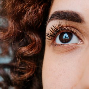 Windmill Reflecting On Eyeball Of Thoughtful Woman