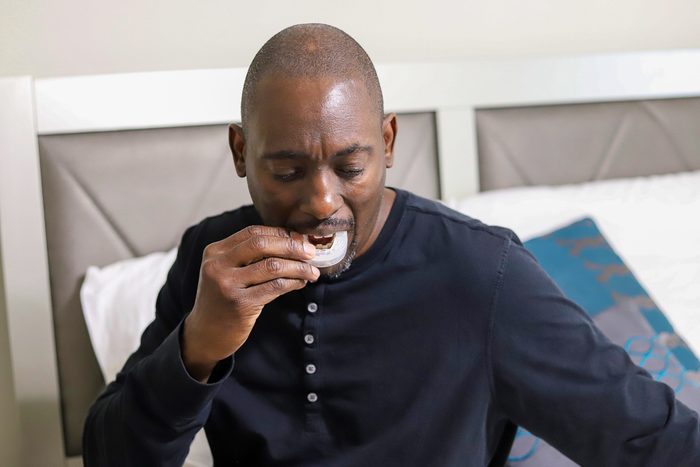 man putting in mouth guard