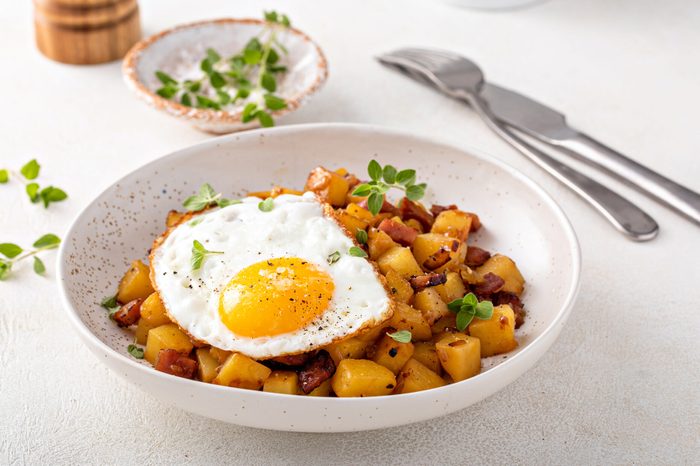 Potato, onion and ham hash topped with fried egg
