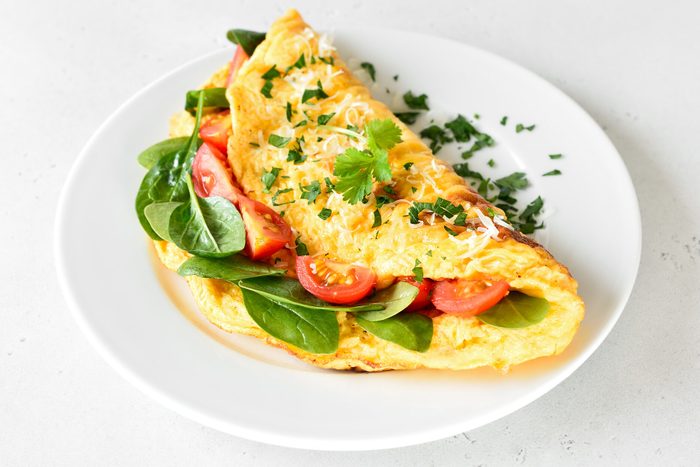 Stuffed omelette with tomatoes and spinach
