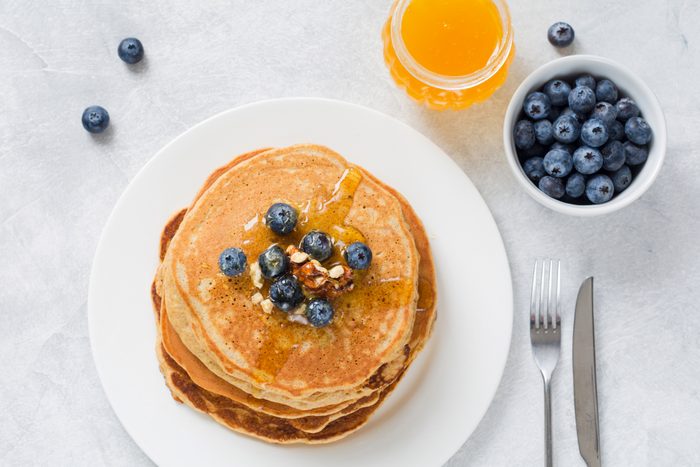 Pancakes with blueberries, honey and walnuts