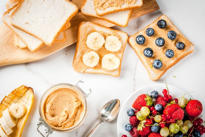 Sandwiches with peanut butter, berry and fruit